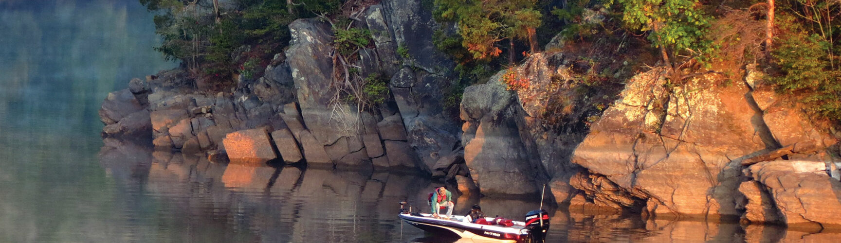 Someone boating on Philpott Lake