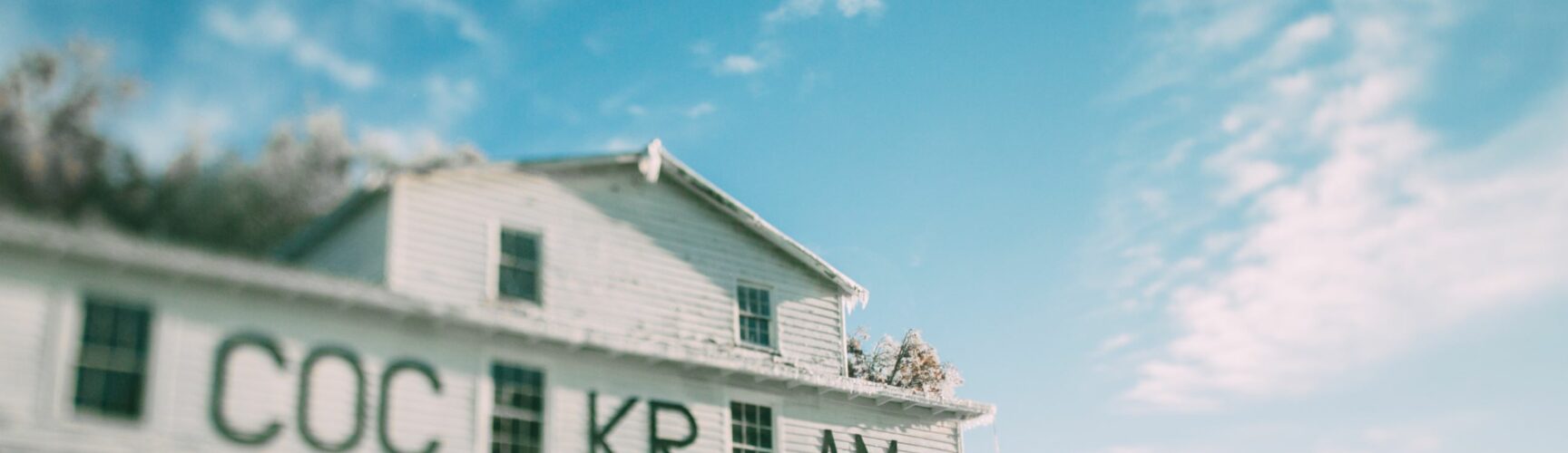 Cockram Mill White building against blue sky