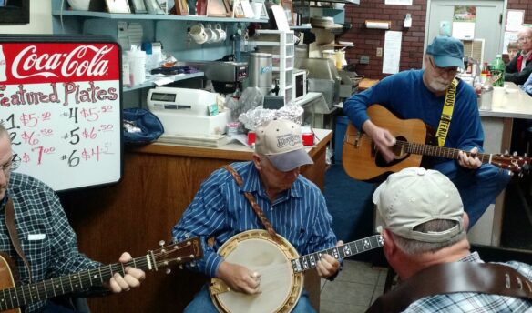 Men with banjos in store