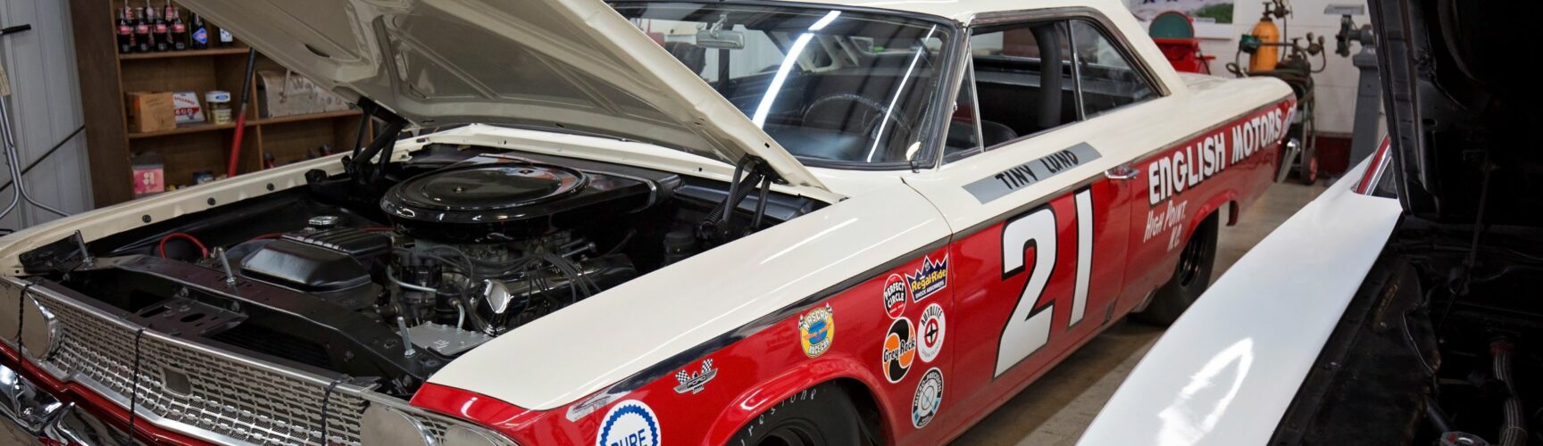 Red racecar with hood up
